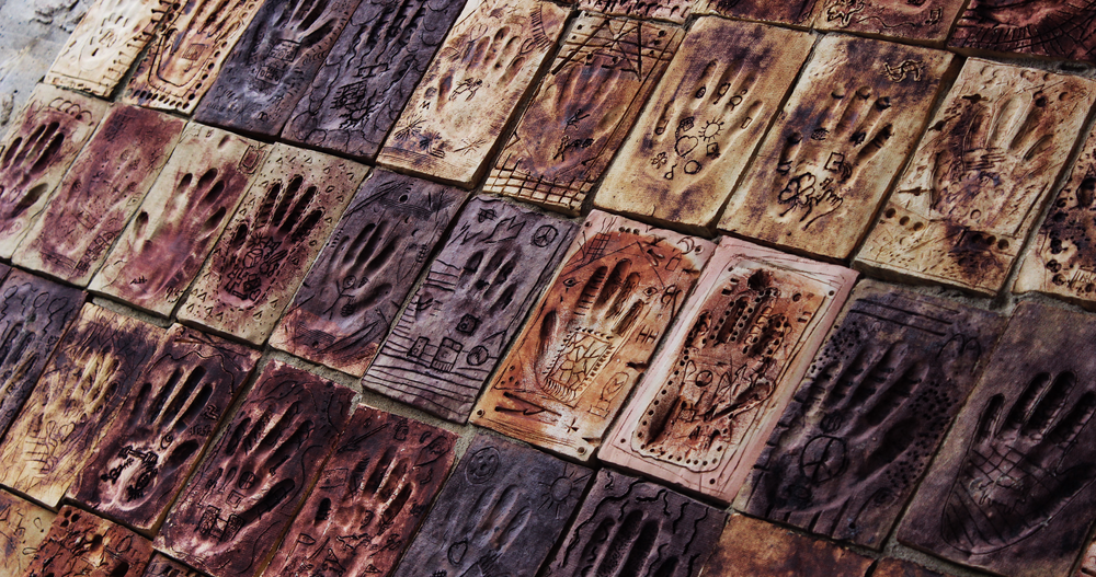 Photo of children's hand impressions in clay